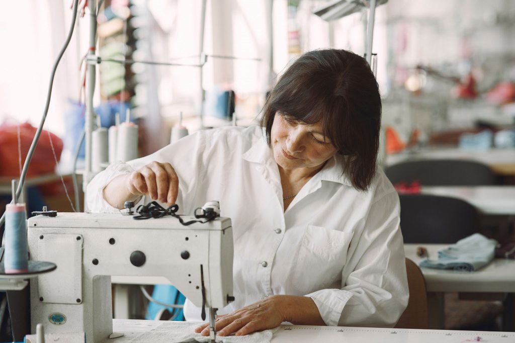 A old women manufacturing clothes